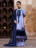 A woman models a traditional South Asian salwar kameez suit. The outfit features a lavender kameez kurta with intricate multicolor floral embroidery and a navy blue border, paired with a matching navy blue dupatta.