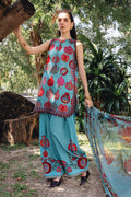 Woman wearing a traditional outfit with floral patterns in an outdoor setting