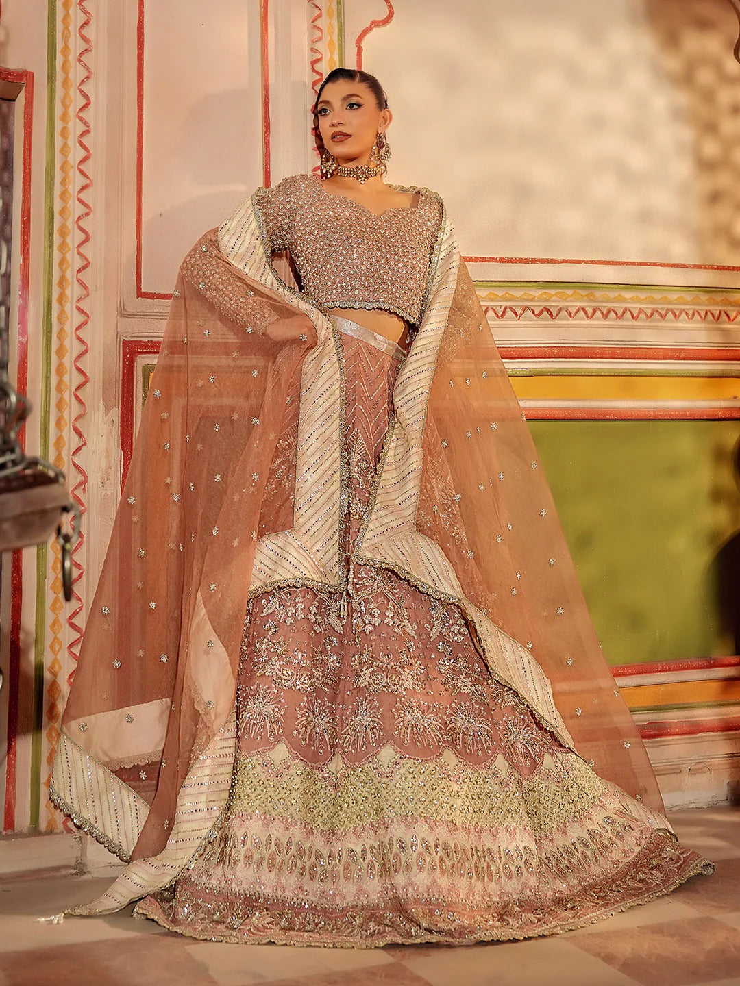 Woman in traditional embroidered outfit with a decorative background