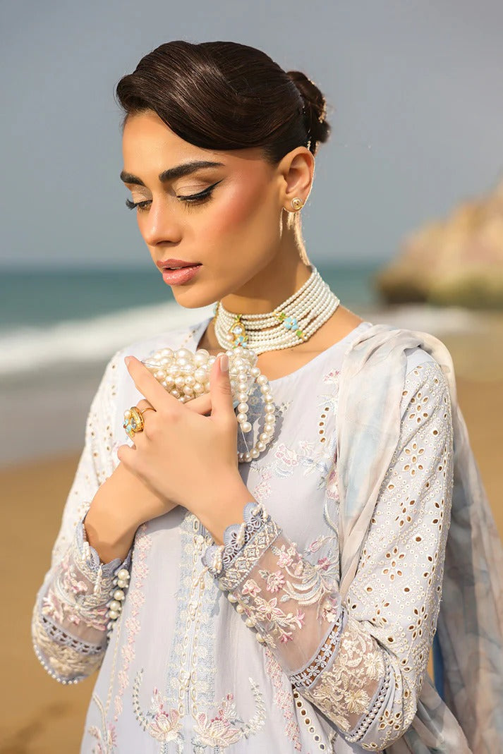 Woman in traditional outfit with jewelry on a beach