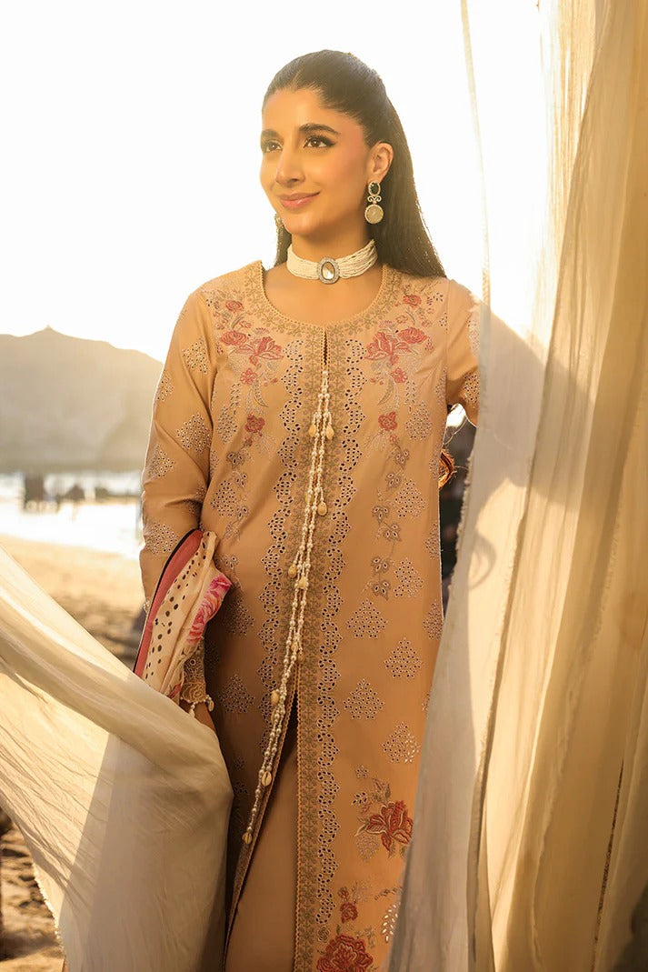 Woman in a beige embroidered outfit with a scenic background