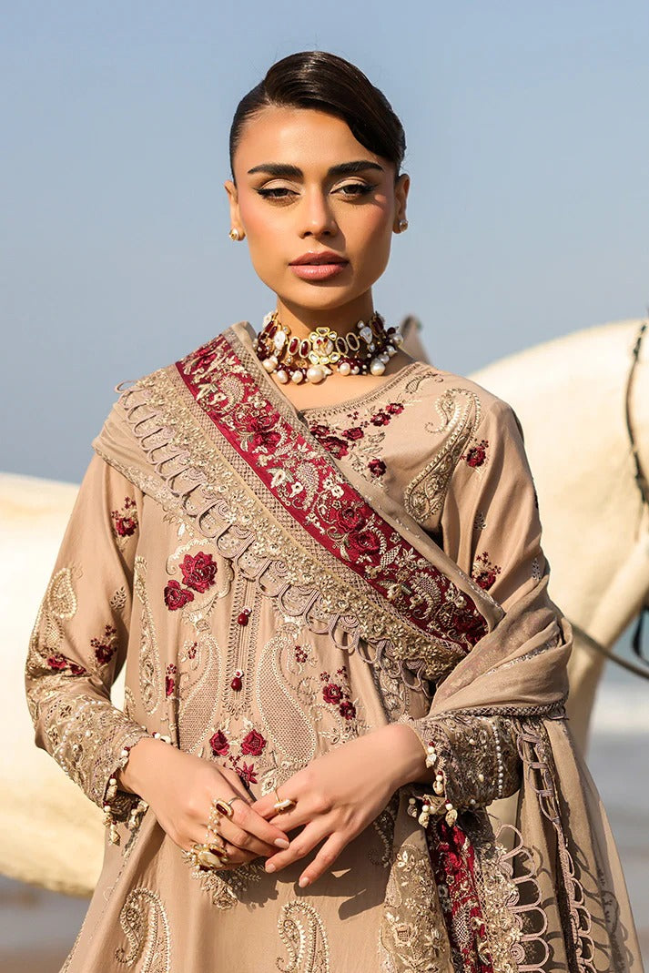 Woman wearing an embroidered traditional outfit with a clear blue sky background