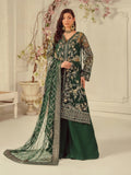 Woman wearing a green embroidered traditional outfit with a white background