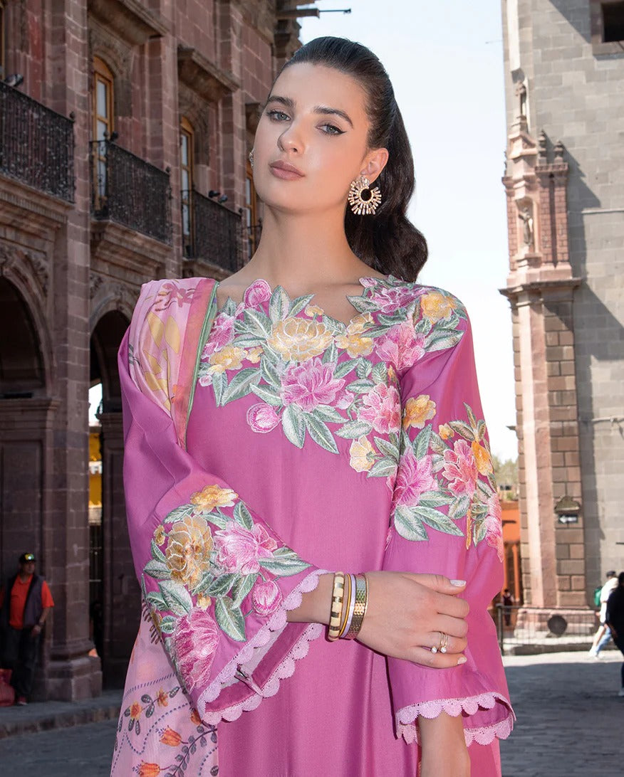 Woman in a pink floral dress standing in an urban setting