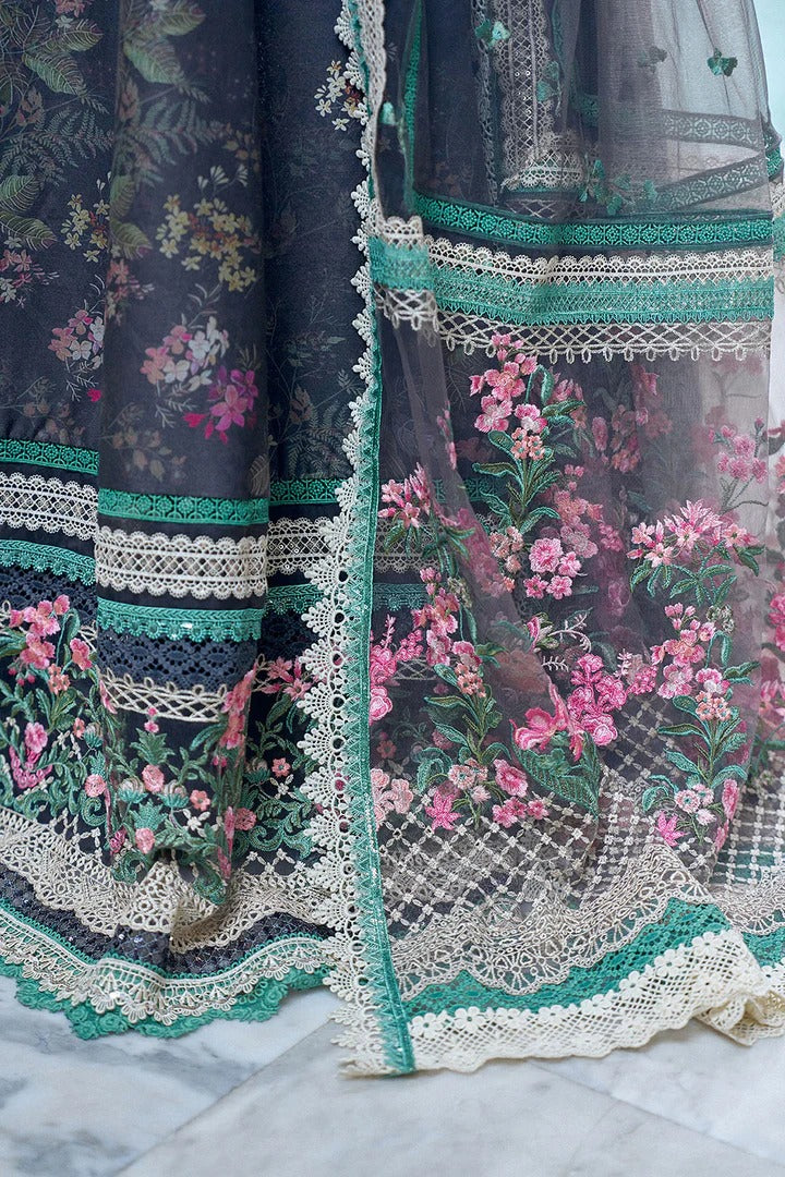 Close-up of a floral embroidered fabric with intricate lace detailing on a marble surface.