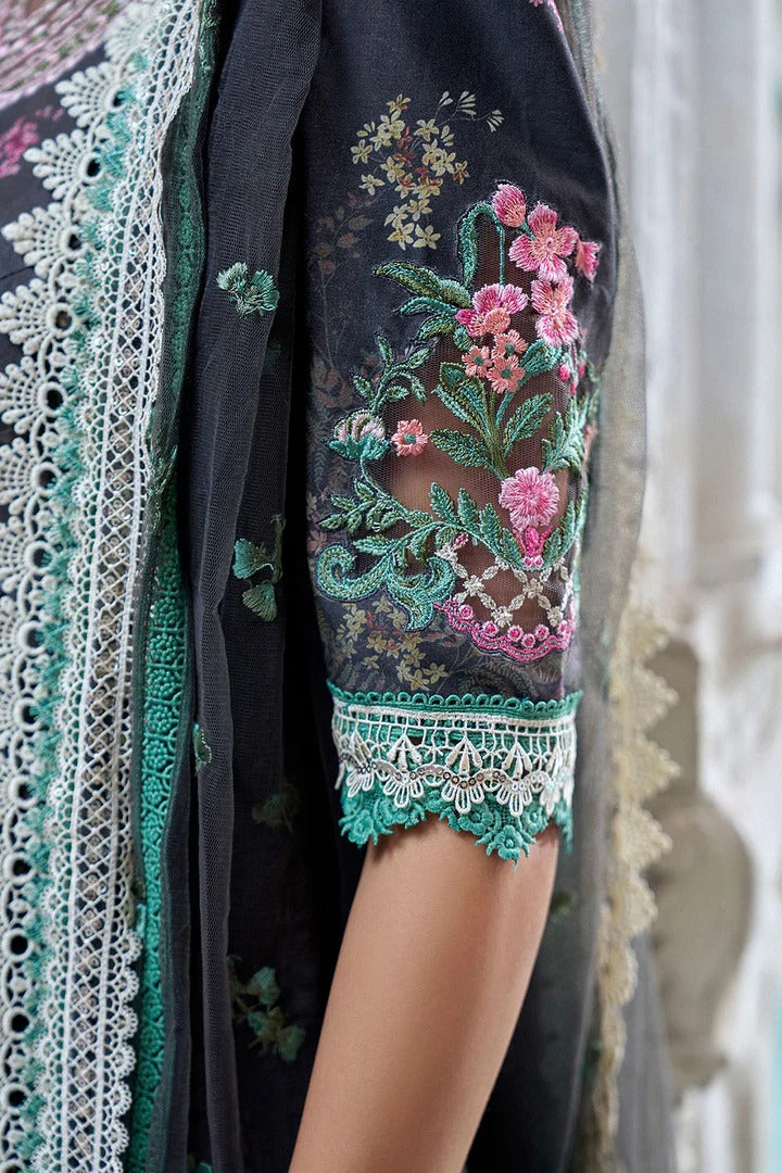 Close-up of a garment with floral embroidery and lace details.