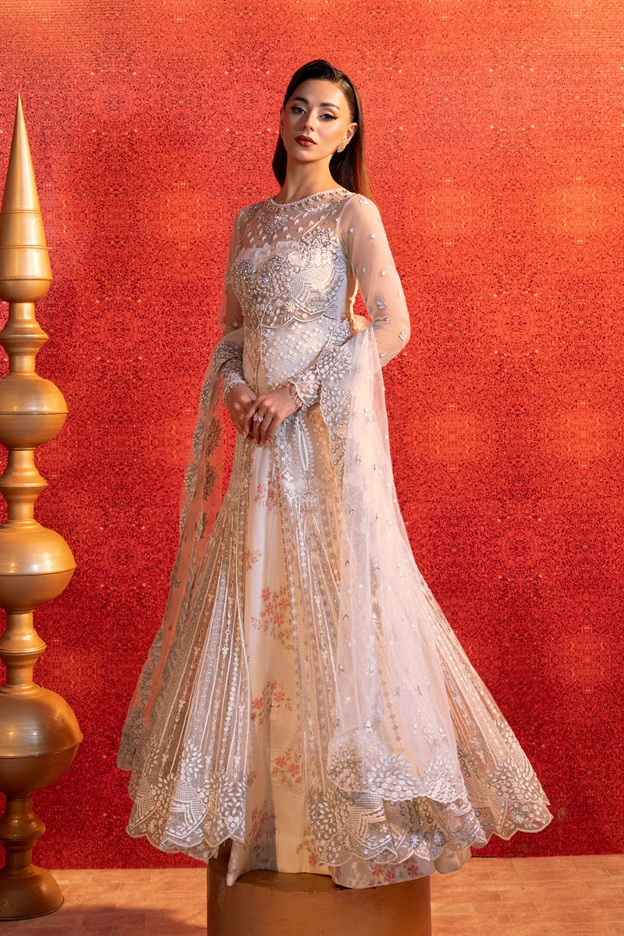Woman in an elegant dress with a red textured background