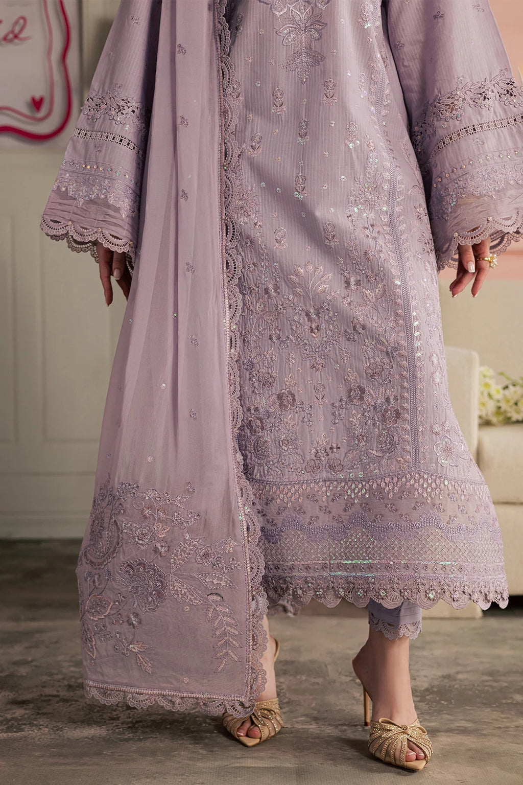 Light purple embroidered traditional outfit with matching dupatta on a neutral background