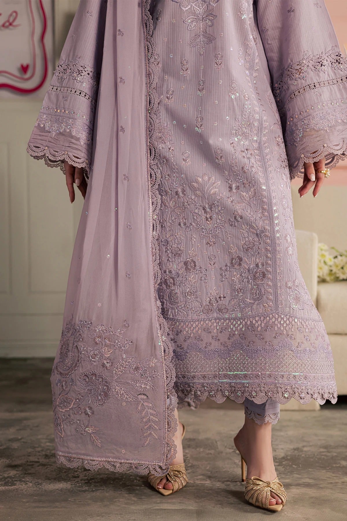 Light purple embroidered traditional outfit with matching dupatta on a neutral background