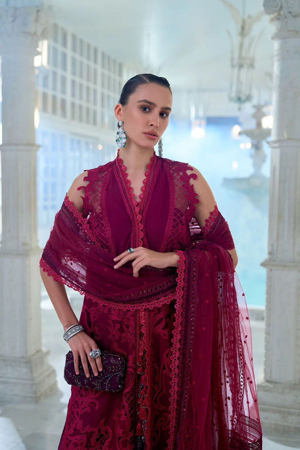 Woman wearing a red lace outfit in an elegant interior setting