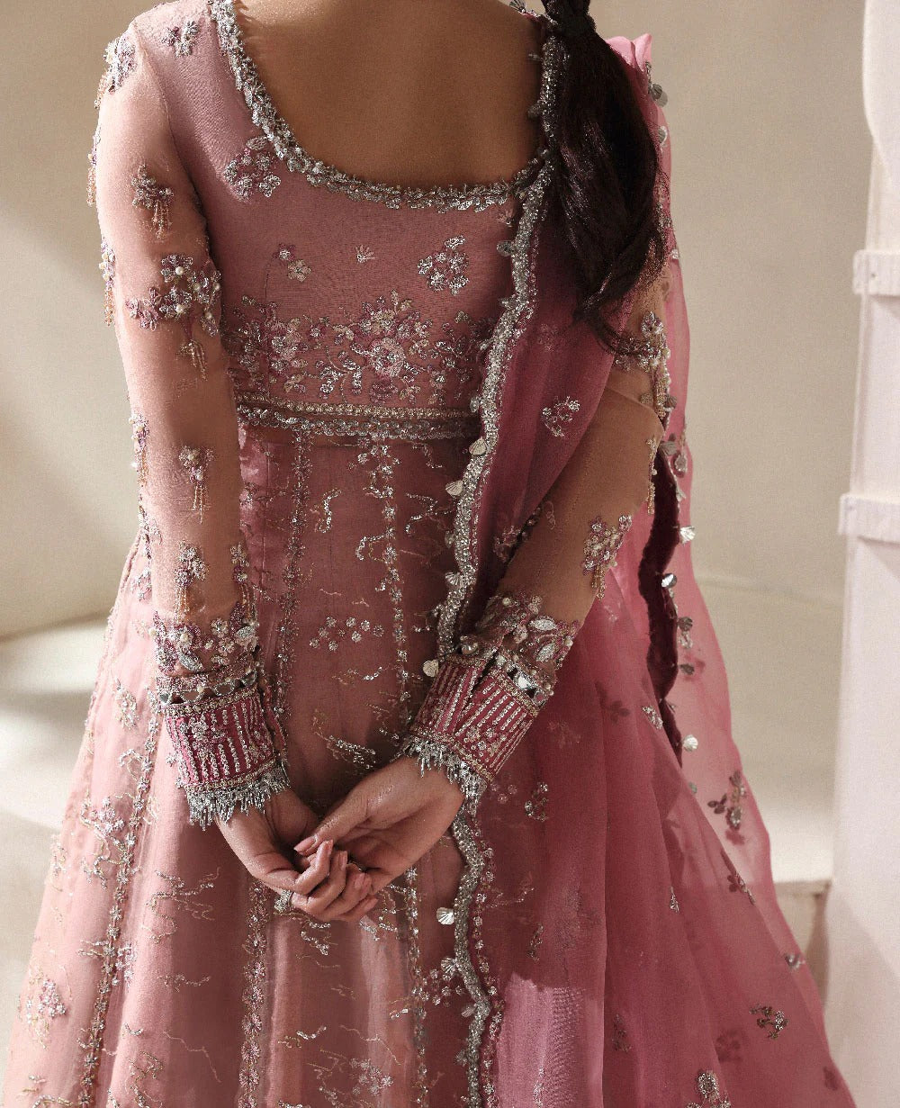 Pink embroidered traditional outfit with intricate detailing