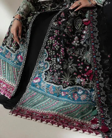 Close-up of an intricately embroidered fabric with floral patterns on a plain background