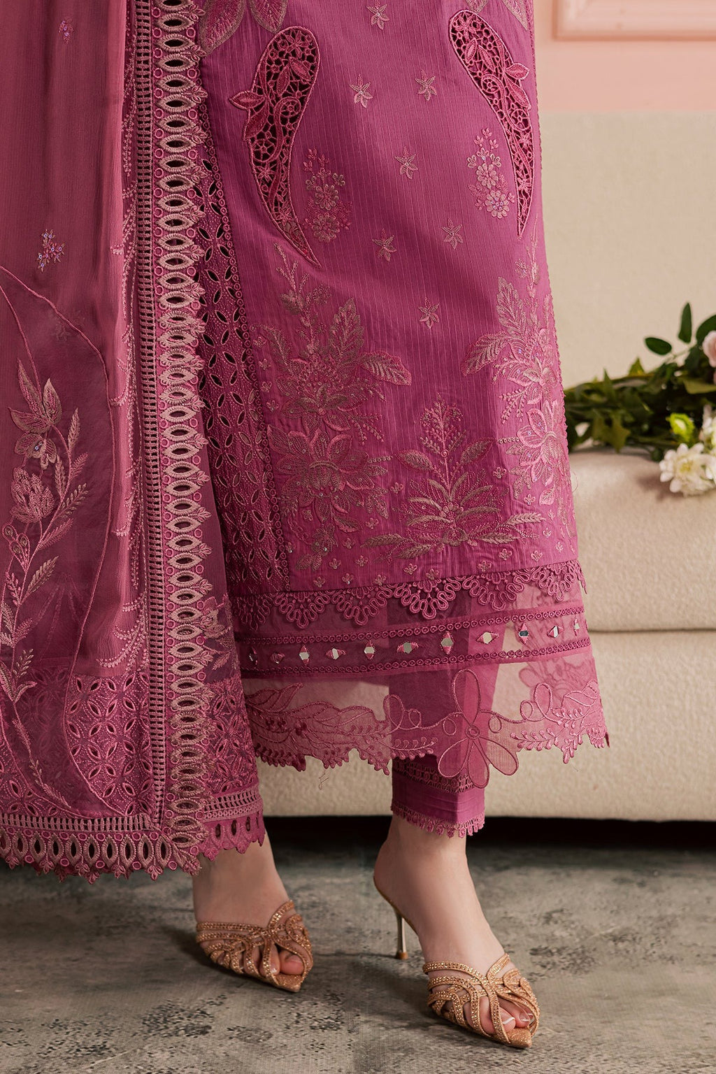 Pink embroidered traditional outfit with matching dupatta on a neutral background